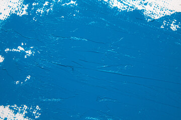 saturated blue abstract background, applied toning primer on a white surface