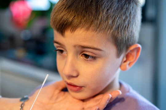 Little boy during nasal antigen test