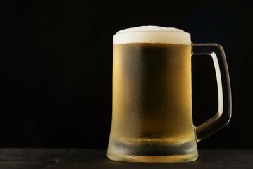glass of beer on black
