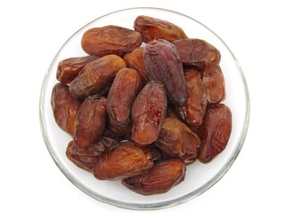 Dates Fruits on a plate isolated white background 