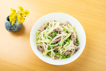 A plate of fried pork with kohlrabi