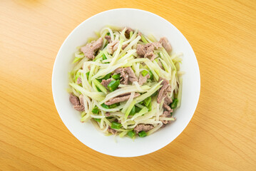 A plate of fried pork with kohlrabi