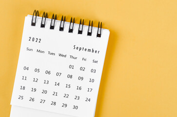 September 2022 desk calendar on light yellow background.