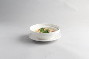 healthy seafood prawn herbal poached rice porridge soup in bowl on white background chinese banquet halal menu