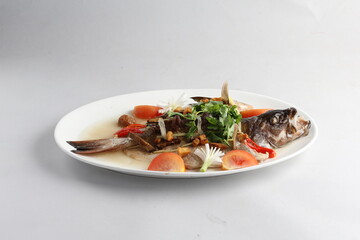 teo chew steamed whole fresh red grouper fish in salted vegetable tomato sauce chinese banquet halal seafood menu on white background