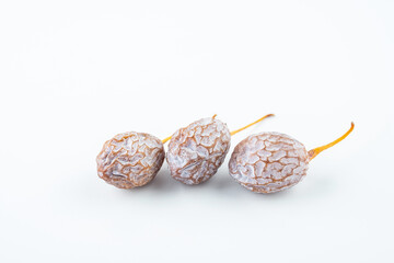 Ginkgo fruit on white background