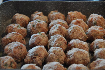 Meatballs with parsley and in breadcrumbs and tomato sauce with spices. Delicious meat dinner dish for potatoes and salads.