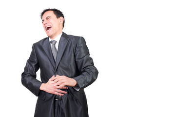 Laughing man in black suit against white background