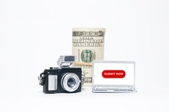 Make money become a content creator and stock photographer concept. In picture miniature camera, laptop with submit now and fake money insight.