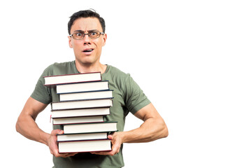 Puzzled male student showing pile of books