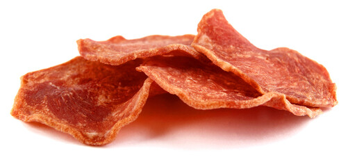 Several pieces of meat chips are isolated on a white background. Full clipping path.