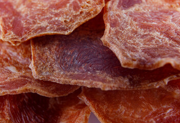 Meat chips. A backdrop of pieces of meat.