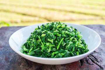 A plate of vegetables stir-fried radish sprouts
