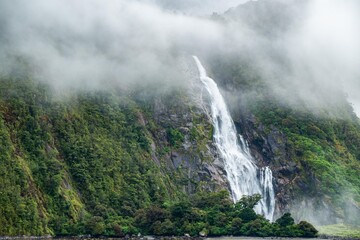 Mystical beautiful waterfall in Milford Sound, New Zealand