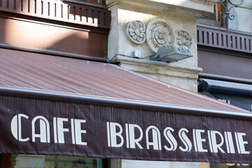 cafe brasserie french sign text means coffee brewery on entrance restaurant in city street...