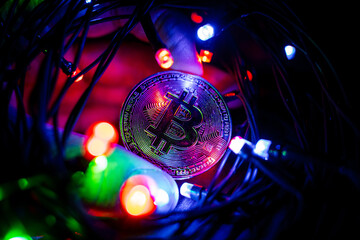 Cryptocurrency. Bitcoin coin against the background of abstract lights. The growing market of...