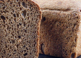 Rye bread , loaf and cut piece .