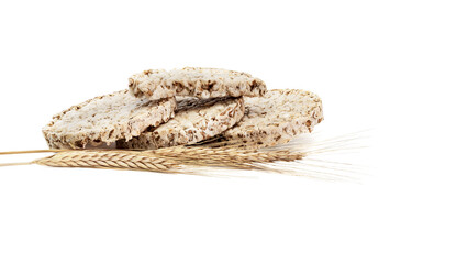 Fitness crispbread with ears of wheat isolated on white background. Healthy diet food. Whole grain crispy bread. Diet bread.