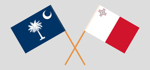 Crossed flags of The State of South Carolina and Malta. Official colors. Correct proportion