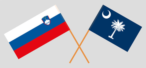 Crossed flags of Slovenia and The State of South Carolina. Official colors. Correct proportion