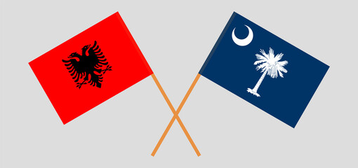 Crossed flags of Albania and The State of South Carolina. Official colors. Correct proportion
