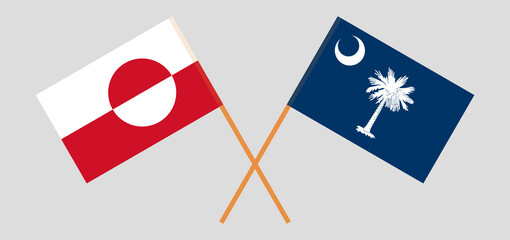 Crossed flags of Greenland and The State of South Carolina. Official colors. Correct proportion