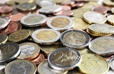 Many coins on table. Euros and cents