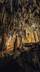 Postojna cave, Slovenia. Formations inside cave with stalactites and stalagmites.