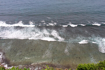 Crashing waves around Uluwatu in Bali. Taken January 2022.