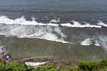 Crashing waves around Uluwatu in Bali. Taken January 2022.