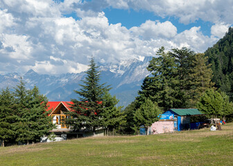 Fototapeta na wymiar Blue Sky with full of White Clouds, and green trees, and the mountain is full of greeneries, a magical view of north Pakistan, Shogran National Park. 