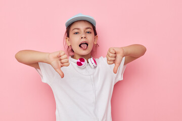 little girl wearing headphones posing emotions isolated background