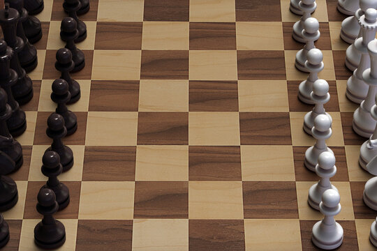 A chessboard and pieces placed on it.