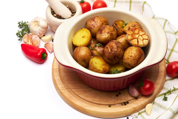 Baked potato in a clay pot isolated on white background