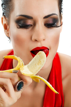 Close-up Female Eating Peeled Banana