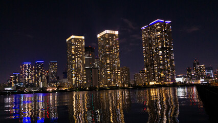Fototapeta na wymiar Night view of a high-rise condominium along an urban river_09