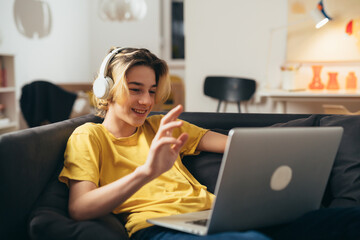 teenager having video chat with his friends