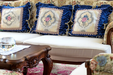 Detail image of Pillows on an antique luxury sofa