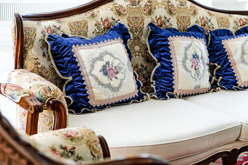 Fototapeta premium Detail image of Pillows on an antique luxury sofa