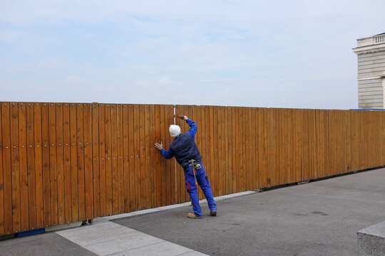 Wooden Fence With Worker