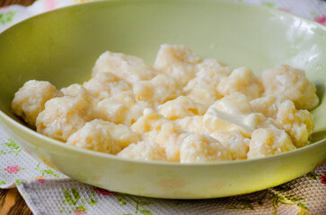 Lazy dumplings with cottage cheese and sour cream.
