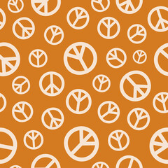 Retro seamless pattern with peace signs and brown background