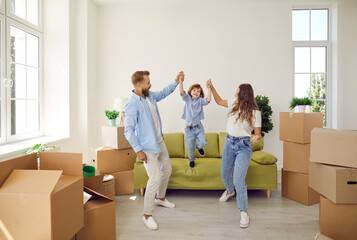 Fototapeta na wymiar Happy young family with kids celebrate moving relocation to new home. Smiling parents with child relax in own house or apartment, buy dwelling on bank mortgage or loan. Rental, tenancy concept.