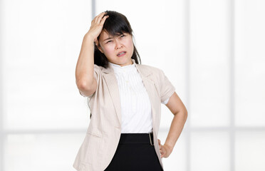 Asian stressed depressed tired exhausted worried frowning face female businesswoman secretary...
