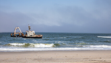 Abandoned shipwreck of the stranded Zeila vessel at the Skeleton Coast near Swakopmund in Namibia,...