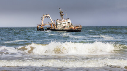 Abandoned shipwreck of the stranded Zeila vessel at the Skeleton Coast near Swakopmund in Namibia,...