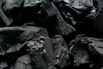 macro charcoal,Black coal background. charcoal woody black. lot of wood,charcoal is a lightweight black carbon reesidue produced by strongly heating wood. charcoal is widely used for cooking or other 