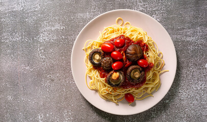 spaghetti,Delicious appetizing classic spaghetti pasta with tomato sauce, parmesan cheese and fresh basil, top view