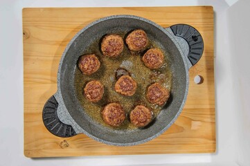 Meatballs in cast iron pan, close up