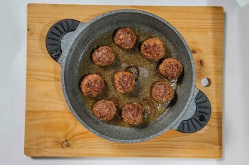 Meatballs in cast iron pan, close up